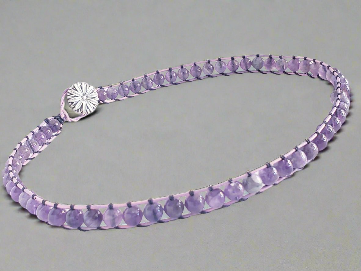 Art of Natural Health jewelry, Handcrated with healing properties of amethyst known to rid negative energy, support sleep, mood, circulation, encourage inner strength, wealth, and clarity of the mind. Made with pink leather cording.