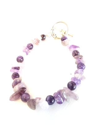 Art of Natural Health gemstone jewelry. This bracelet uses the various healing properties of amethyst. Amethyst has been used to provide clarity, regulating mood swings, relieving stress and anxiety. It also is said to bring emotional stability and inner strength.
