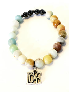 This bracelet, inspired by relaxing on the beach watching the tides roll in, feet buried in the sand. Love yourself, love others!  Made with Jasper and Hematite. Jasper help balance emotional energies in the body, comforting, relaxing, and protective. Jasper is known as the "supreme nuturer", supports you during times of stress.